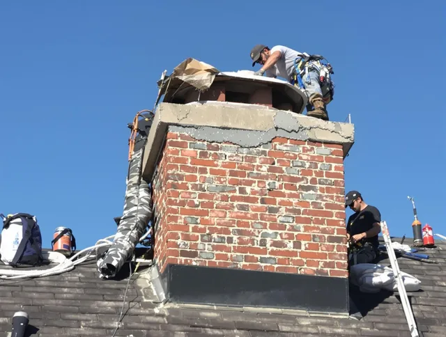 Buena Park Chimney Sweep installing a custom chimney crown in Buena Park, CA