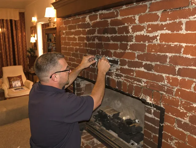 Buena Park Chimney Sweep expert fixing a fireplace in Buena Park, CA